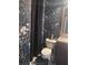 Stylish bathroom with floral wallpaper, dark curtains, and black and white patterned floors at 3740 Tupelo Trl, Auburn, GA 30011