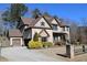 Beautiful two story home featuring brick and siding accents, manicured front yard and two-car garage at 3740 Tupelo Trl, Auburn, GA 30011