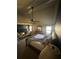 Bright bedroom with vaulted ceilings and large windows, furnished with a comfortable bed and stylish decor at 3740 Tupelo Trl, Auburn, GA 30011