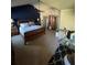 Spacious bedroom featuring a well-made bed, vaulted ceiling with a fan, and matching furniture at 3740 Tupelo Trl, Auburn, GA 30011
