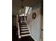 Staircase with decorative wallpaper and lighting at 3740 Tupelo Trl, Auburn, GA 30011