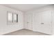 Neutral bedroom features carpeted floors, shuttered window, and a double door closet at 2930 Torreya Se Way, Marietta, GA 30067