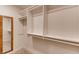 A well-organized walk-in closet with custom shelving and hanging rods offers ample storage at 2930 Torreya Se Way, Marietta, GA 30067