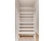Hall closet with built-in white shelving and carpet at 2930 Torreya Se Way, Marietta, GA 30067