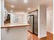 Kitchen with stainless steel appliances, custom cabinets, and breakfast bar at 2930 Torreya Se Way, Marietta, GA 30067