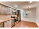 Kitchen with natural cabinets, stainless steel appliances, and stylish pendant lighting at 2930 Torreya Se Way, Marietta, GA 30067