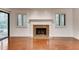 Living room with fireplace, hardwood floors, white trim and sliding glass door to back yard at 2930 Torreya Se Way, Marietta, GA 30067