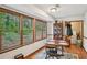 Breakfast nook with wood floors and walls of bright windows at 460 Rocky Creek Dr, Hampton, GA 30228