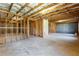Unfinished basement featuring framed walls and open ceiling, offering customization and expansion opportunities at 5255 Austrian Pine Ct, Cumming, GA 30040