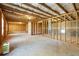 Unfinished basement with exposed beams, ready for customization and additional living space at 5255 Austrian Pine Ct, Cumming, GA 30040