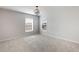 Bright bedroom with neutral walls, plush carpeting, and natural light from dual windows at 5255 Austrian Pine Ct, Cumming, GA 30040