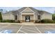 Community clubhouse exterior view, showcasing architectural style and manicured landscaping at 5255 Austrian Pine Ct, Cumming, GA 30040