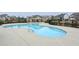 Community pool with chairs, tables, and umbrellas. Swimming pool features a -safe shallow end at 5255 Austrian Pine Ct, Cumming, GA 30040