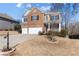 Attractive two-story home featuring a brick facade, attached garage, and well-maintained front yard at 5255 Austrian Pine Ct, Cumming, GA 30040