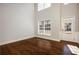 Bright living room with hardwood floors, and large windows allowing ample natural light at 5255 Austrian Pine Ct, Cumming, GA 30040