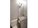 Bathroom with single sink vanity, tile floors and a toilet at 1322 Lorenzo Sw Dr, Atlanta, GA 30310