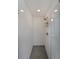 Bathroom featuring tiled walls, mosaic details and a glass shower door at 1322 Lorenzo Sw Dr, Atlanta, GA 30310