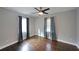 This bedroom offers hardwood floors and a modern ceiling fan at 1322 Lorenzo Sw Dr, Atlanta, GA 30310