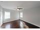 Bedroom features hardwood floors, ceiling fan and ample natural light at 1322 Lorenzo Sw Dr, Atlanta, GA 30310