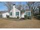 Quaint white brick home with blue shutters, covered entry, and well-maintained landscaping at 1322 Lorenzo Sw Dr, Atlanta, GA 30310