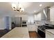 Well-lit kitchen featuring stainless steel appliances, granite countertops, and a stylish island at 1322 Lorenzo Sw Dr, Atlanta, GA 30310