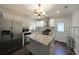 Modern kitchen features stainless steel appliances, granite counters, and ample cabinet space at 1322 Lorenzo Sw Dr, Atlanta, GA 30310