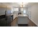 Updated kitchen features stainless steel appliances, granite counters, and a center island at 1322 Lorenzo Sw Dr, Atlanta, GA 30310