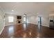 Spacious living room features a stone fireplace, hardwood floors, and bright natural light at 1322 Lorenzo Sw Dr, Atlanta, GA 30310