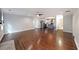 Open-concept living space with hardwood floors flowing into a modern kitchen and updated bathroom at 1322 Lorenzo Sw Dr, Atlanta, GA 30310