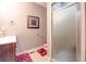 Bathroom featuring tile flooring, glass shower, and dark wood vanity at 18 Commerce Row, Cartersville, GA 30121