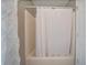 Bathroom with a built in shower and white shower curtain at 18 Commerce Row, Cartersville, GA 30121