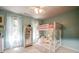 A childs bedroom featuring bunk beds, white carpet and ample natural light at 18 Commerce Row, Cartersville, GA 30121