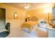 Bedroom featuring a queen bed, yellow walls, and natural light at 18 Commerce Row, Cartersville, GA 30121