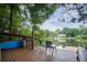 Waterfront deck overlooking calm lake, complete with kayak storage and seating area at 18 Commerce Row, Cartersville, GA 30121