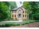 Inviting two-story house with a stone accent wall and a neatly manicured front yard at 18 Commerce Row, Cartersville, GA 30121