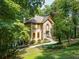 Charming two-story home featuring a stone facade and well-maintained landscaping at 18 Commerce Row, Cartersville, GA 30121