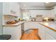 Bright kitchen with white cabinetry, tile backsplash, wooden countertops, and stainless appliances at 18 Commerce Row, Cartersville, GA 30121