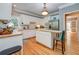 Well-lit kitchen featuring white cabinets and modern appliances at 18 Commerce Row, Cartersville, GA 30121