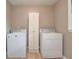 This laundry room features a washer and dryer and plenty of room for storage at 18 Commerce Row, Cartersville, GA 30121