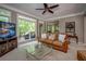 Cozy living area with large windows that look out to the deck and nature views at 18 Commerce Row, Cartersville, GA 30121
