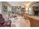 Inviting living room with a stone fireplace and expansive bookshelf at 18 Commerce Row, Cartersville, GA 30121