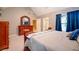 Bedroom with vaulted ceiling, carpet, and window with blue curtains at 18 Commerce Row, Cartersville, GA 30121