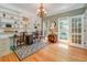Well-lit office featuring built-in shelving, hardwood floors, and double doors to the outside at 18 Commerce Row, Cartersville, GA 30121