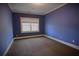 Cozy bedroom showcasing a window and carpeted floors, illuminated by natural light from the window at 2313 Bouldercliff Way, Atlanta, GA 30316