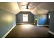 Large bedroom featuring a unique ceiling, window, carpet, and ample space at 2313 Bouldercliff Way, Atlanta, GA 30316