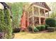 Exterior view of a two-story home featuring a covered porch and landscaped yard at 2313 Bouldercliff Way, Atlanta, GA 30316