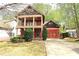 Inviting two-story home with a charming front porch and well-manicured landscaping at 2313 Bouldercliff Way, Atlanta, GA 30316