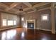 Bright living room with hardwood floors, fireplace, and coffered ceiling at 2313 Bouldercliff Way, Atlanta, GA 30316