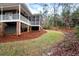 View of the backyard featuring a covered porch and spacious lawn area at 2691 Jamerson Rd, Marietta, GA 30066