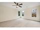 An empty bedroom with carpet and windows providing light and views to the wooded backyard at 2691 Jamerson Rd, Marietta, GA 30066
